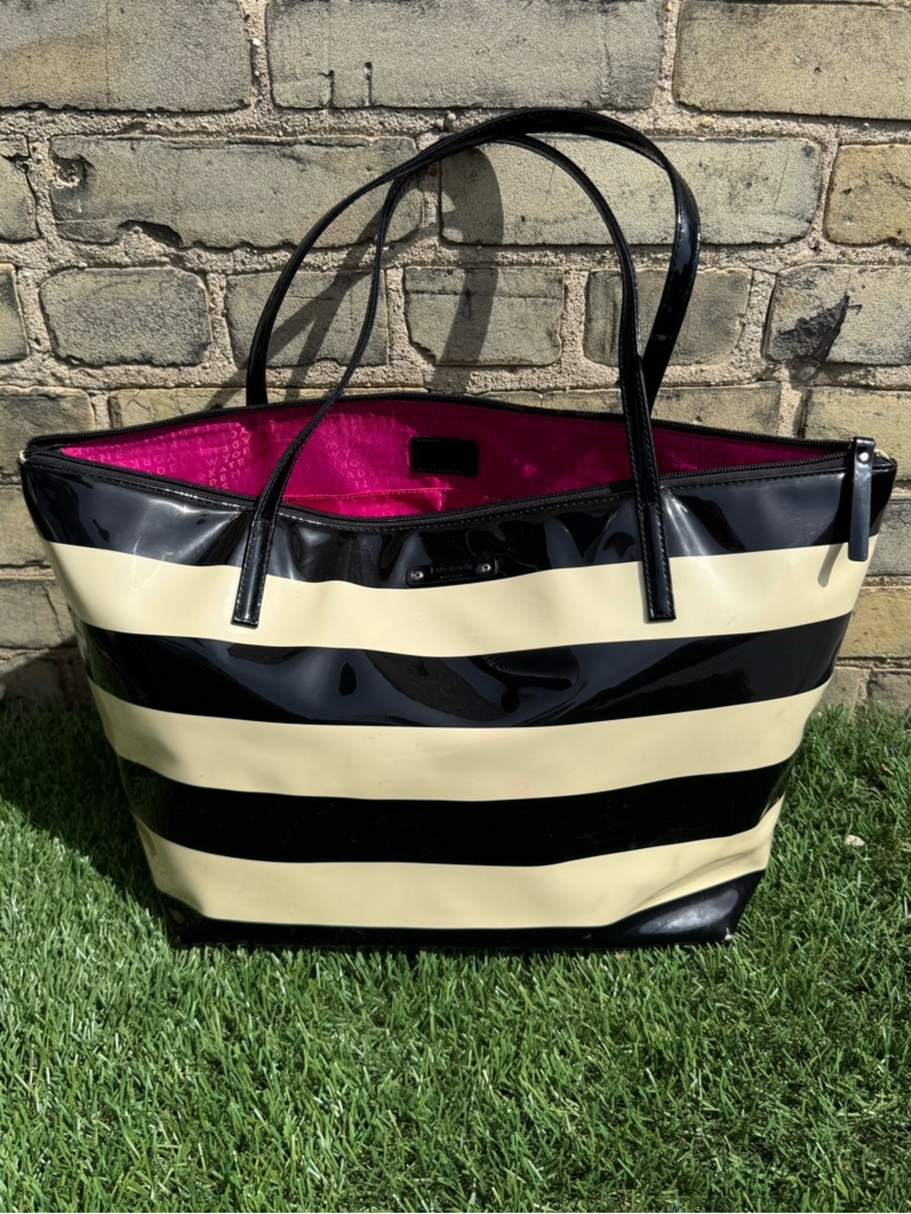 Kate Spade striped tote bag with neon magenta interior